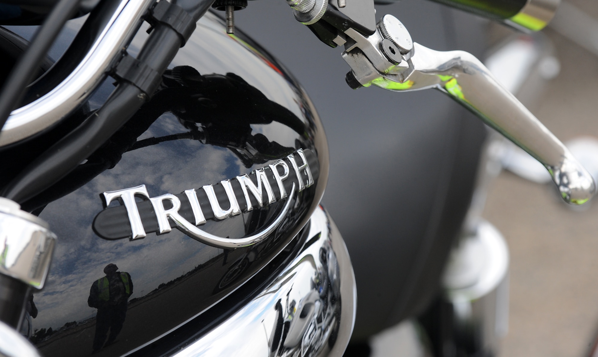 An event participant and his bike can be seen in the reflection of this motorcycle’s gas tank at the ‘See Me, Save Me’ campaign ride at Hill Air Force Base, Utah, July 11. The goal of the ride was to motivate motorists to take a second look for motorcycles on the road. (U.S. Air Force photo by Alex R. Lloyd/Released)