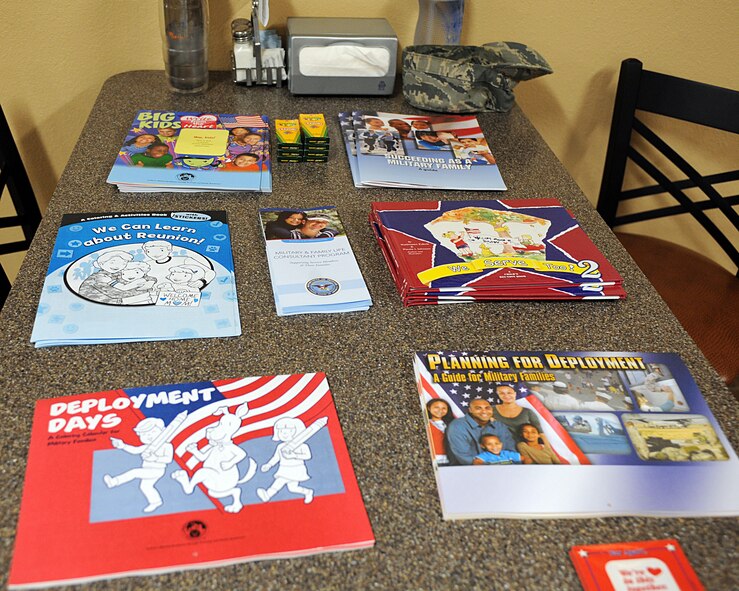 Various forms of information sit on a table in the Desert Dining Inn at Davis-Monthan Air Force Base, Ariz., July 10, 2013. The information was provided as part of the Deployed Spouses’ Dinner here. They deal with a plethora of military family-related things, including topics covering situations that may arise before, during and after a deployment. (U.S. Air Force photo by Senior Airman Timothy Moore/Released)