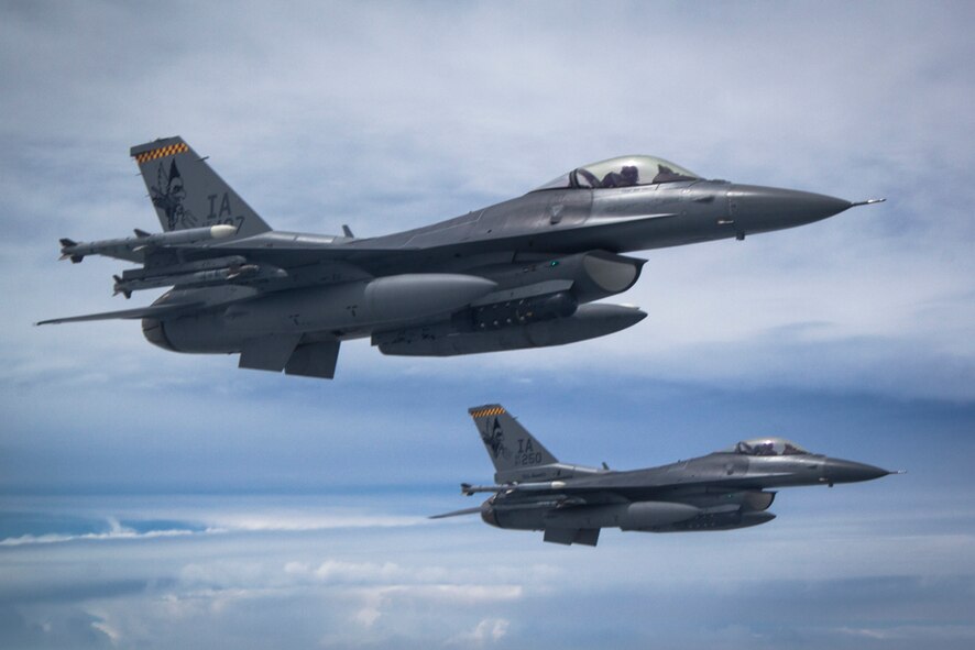 Two F-16 Fighting Falcons of the 132nd Fighter Wing, Des Moines, Iowa are seen flying in the skies over western Iowa on June 21, 2013.  (U.S. Air National Guard photo by Senior Airman Dustin M. Smart/Released)