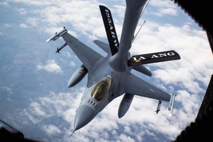 An F-16 Fighting Falcon from the 132nd Fighter Wing, Des Moines, Iowa, recieves fuel from a KC-135 Stratotanker of the 185th Air Refueling Wing, Sioux City, Iowa, in the skies over western Iowa on June 21, 2013. (U.S. Air National Guard photo by Senior Airman Dustin M. Smart/Released)