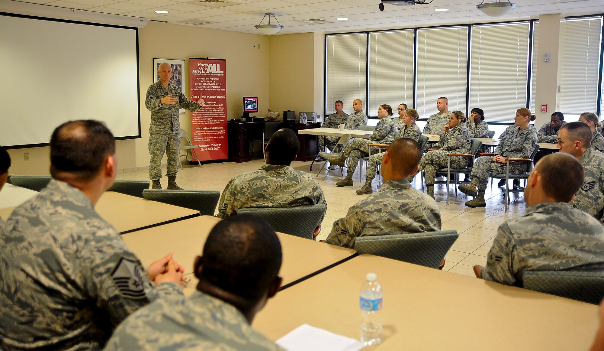 Chief Master Sgt. Richard A. Kaiser, Air Mobility Command command chief, addresses Airmen from Air Force Mortuary Affairs Operations during an enlisted all-call at Dover Air Force Base, Del., July 9, 2013. Chief discussed concerns, answered questions and thanked the Airmen for their commitment to providing dignity, honor and respect for fallen heroes. (U.S. Air Force photo by Senior Airman Melanie Bulow-Kelly/Released)
