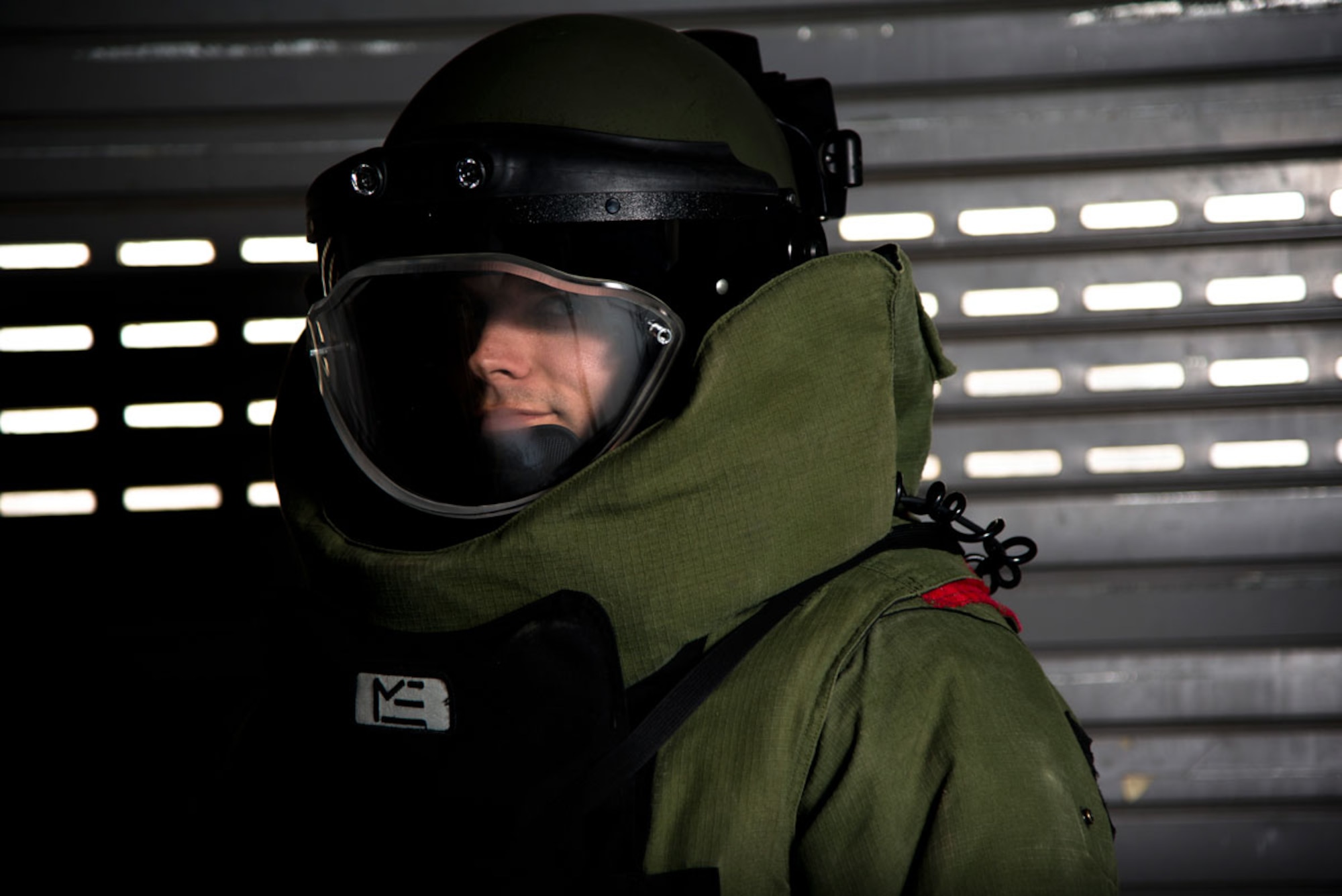 Air Force Master Sgt. Andrew Adrian, Explosive Ordnance Flight, 673d Civil Engineer Squadron, poses May 15, wearing an Advanced Bomb Suit. The suit protects EOD troops from fragmentation, blast pressure, heat and flame. (U.S. Air Force photo/Airman 1st Class Omari Bernard)