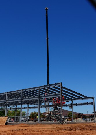 Contractors work on the new Wing Operations & Training Facility at Beale Air Force Base, Calif., July 9, 2013. The building will house the 162nd Combat Communications Group, a California Air National Guard unit based out of Sacramento. (U.S. Air Force photo by Senior Airman Allen Pollard/Released)
