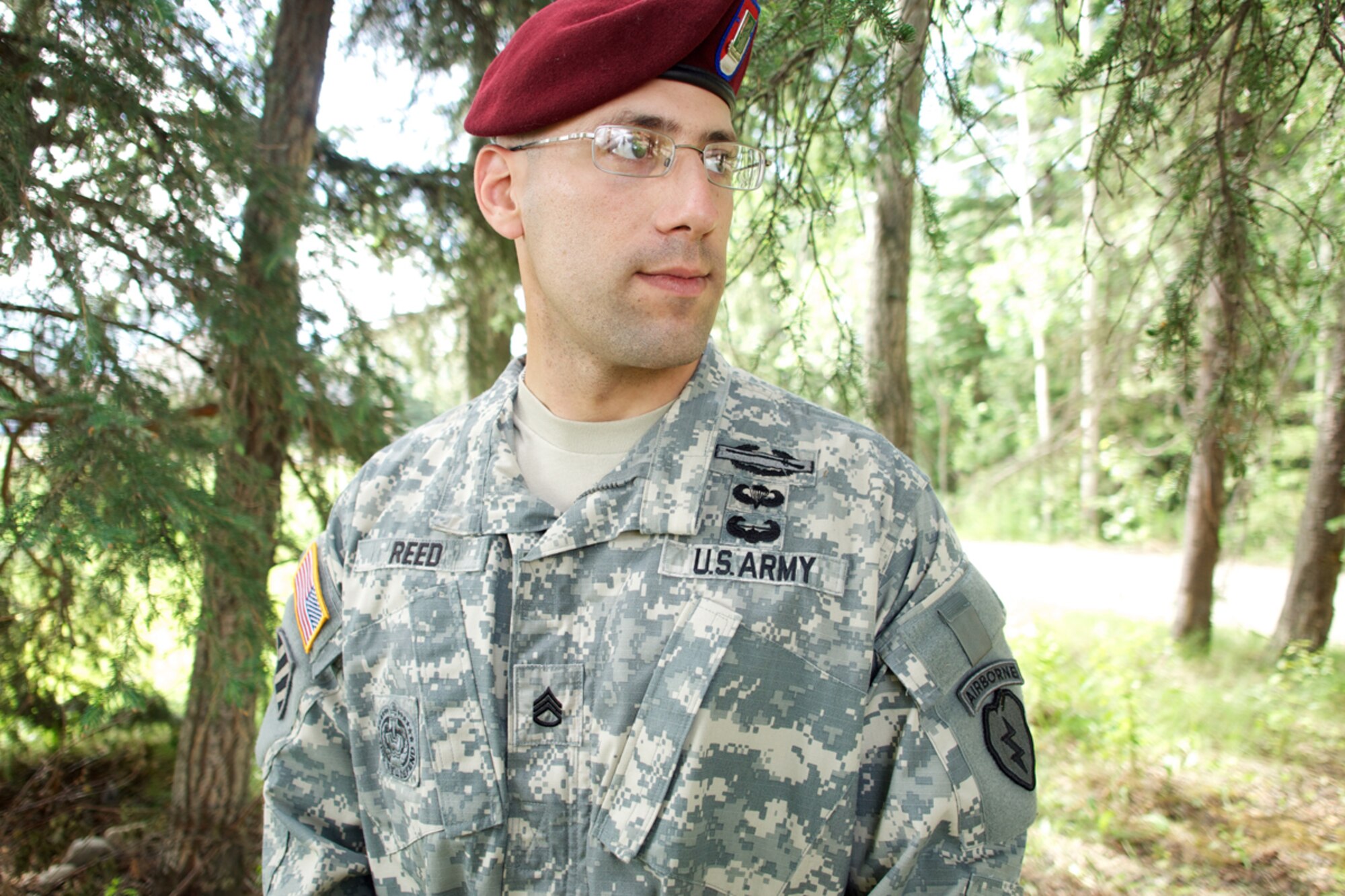 JOINT BASE ELMENDORF-RICHARDSON, Alaska -- Army Staff Sgt. De Gosh Reed, 1st Squadron (Airborne), 40th Cavalry Regiment, poses for a portrait near the Soldiers' Chapel, July 10, 2013. Reed competed in and won the U.S. Army Pacific Best Warrior Noncommissioned Officer for 2013. (U.S. Air Force photo/David Bedard) 