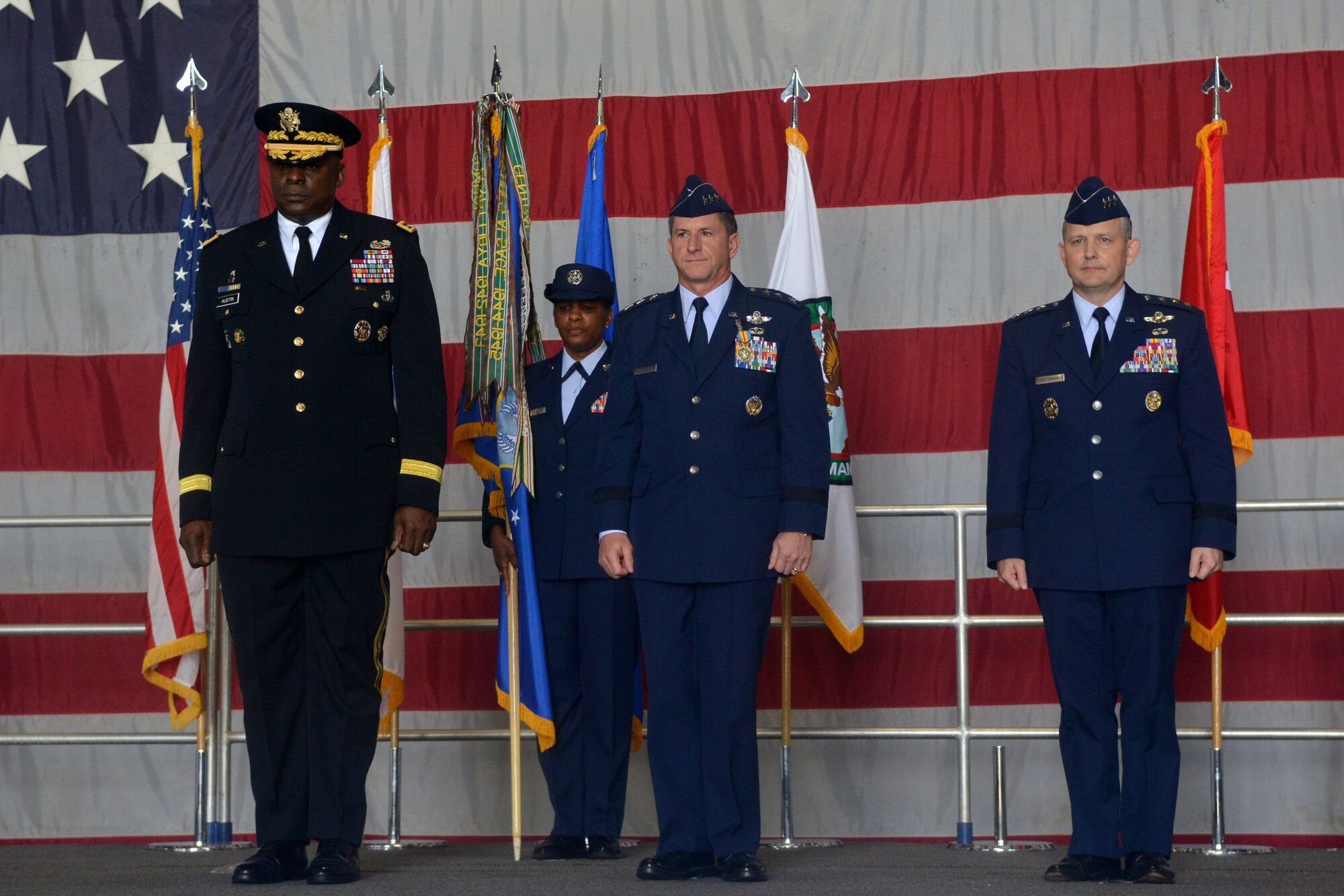 The former and future leaders of USAFCENT stand at attention during a change of command ceremony, Shaw Air Force Base, S.C., July 11, 2013. Taking command is Lt. Gen. John W. Hesterman III as Lt. Gen. David Goldfein relinquishes command. The presiding officer over the change of command was U.S. Army Gen. Lloyd J. Austin. (U.S. Air Force photo by Airman 1st Class Ashley L. Gardner/Released)