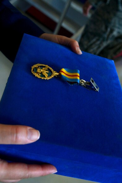 The Defense Distinguished Service Medal is held in presentation during the United States Air Force Central Command change of command ceremony, Shaw Air Force Base, S.C., July 11, 2013. USAFCENT Airmen came together to welcome their new commander.  (U.S. Air Force photo by Airman 1st Class Ashley L. Gardner/Released)