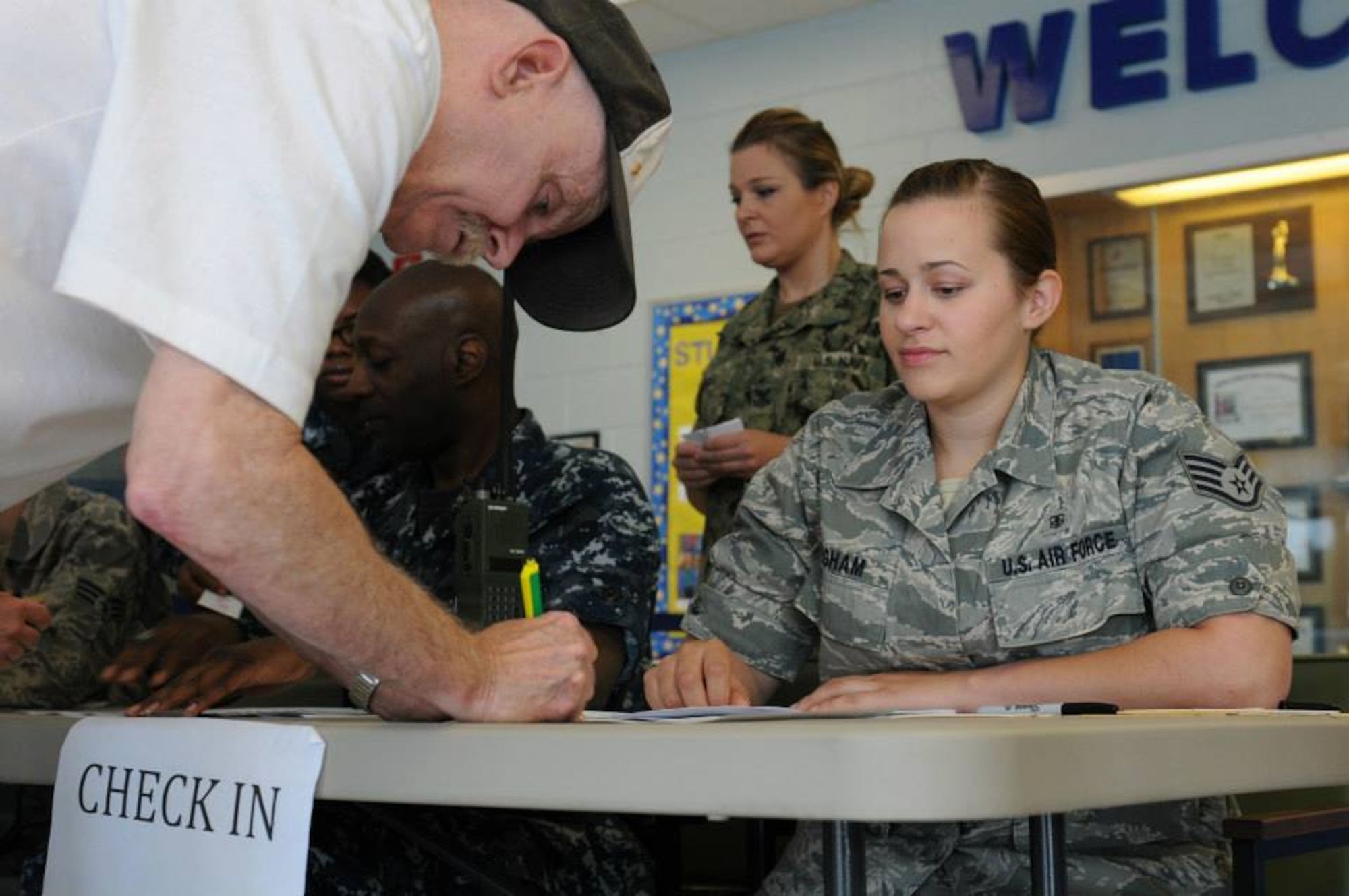 Air Force Staff Sgt. Rebecca Bingham, a medical service technician with the 192nd Fighter Wing, Joint Base Langley-Eustis, Va. checks in patients June 10, 2013 at ‘Hope of Martin’ Innovative Readiness Training held at Martin Middle School in Martin, Tenn. (Air Force Photo by Tech. Sgt. Meghan Skrepenski, Virginia Air National Guard Public Affairs)