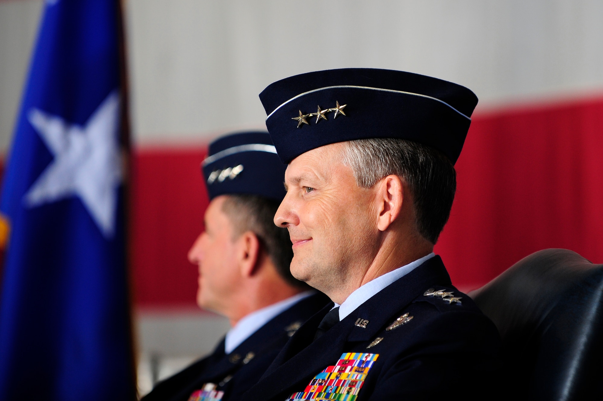 Lieutenant Gen. David L. Goldfein (left), and Lt. Gen. John W. Hesterman sit and listen as Gen. Lloyd J. Austin gives remarks during the Air Forces Central Command change of command ceremony at Shaw Air Force Base, S.C., July 11, 2013. As the new AFCENT commander, Hesterman will be responsible for developing contingency plans and conducting air operations in a 20-nation area of responsibility covering central and southwest Asia. (U.S. Air Force photo by Airman 1st Class Daniel Blackwell/Released)