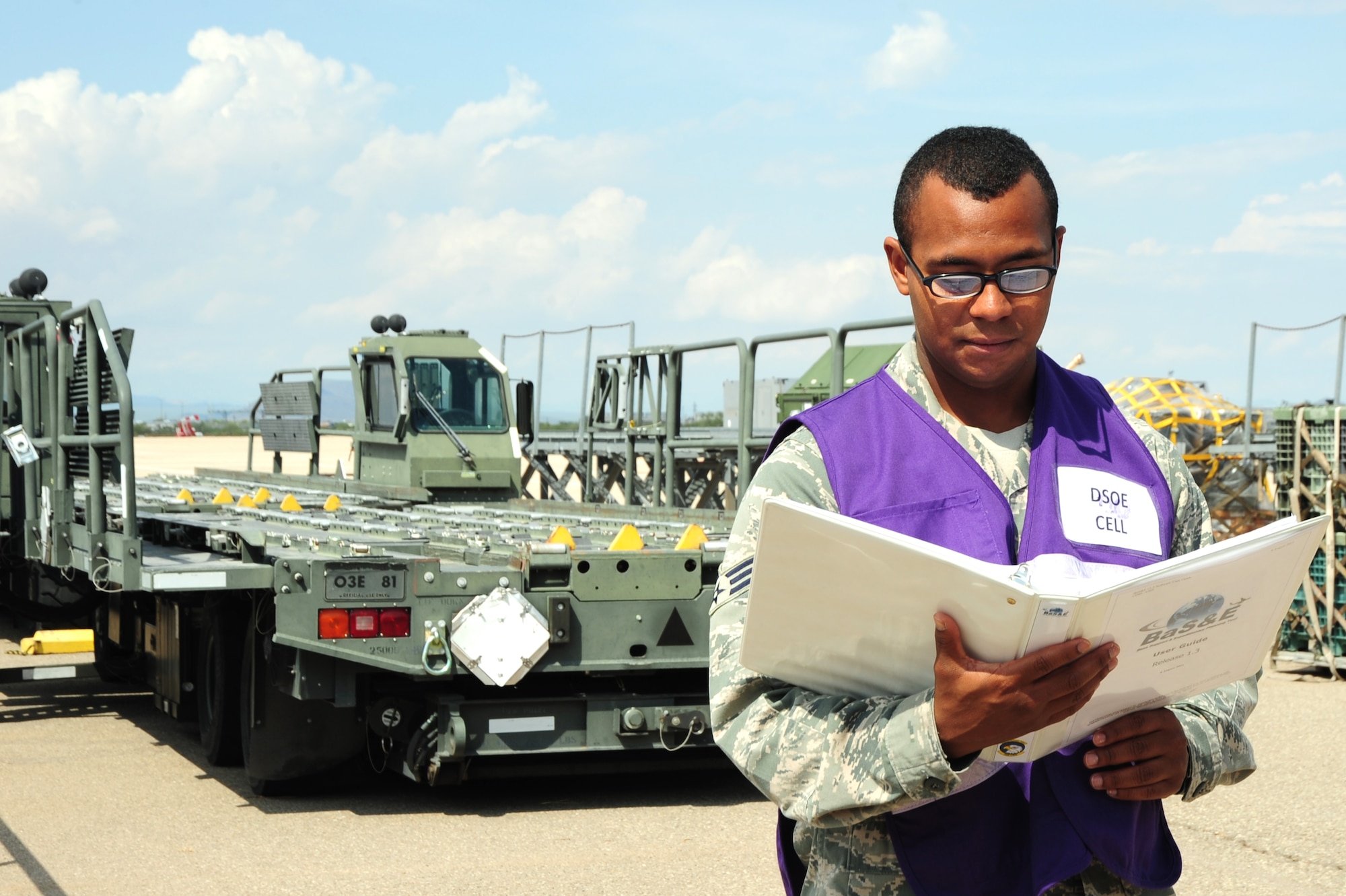 U.S. Air Force Senior Airman Sammie Ervan, 355th Logistics Readiness Squadron Base Support Plan manager, reviews a checklist at Davis-Monthan Air Force Base, Ariz, July 11, 2013. There are over 22 units that participate in the BSP review annually. (U.S. Air Force photo by Senior Airman Camilla Griffin/ Released)