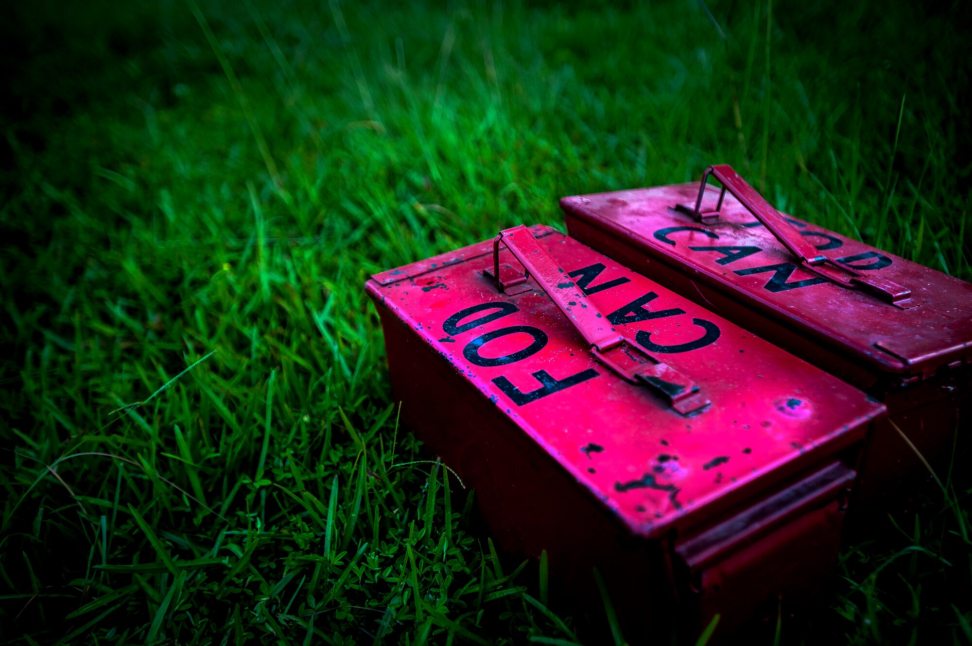 Two ammo cans filled with various amounts of rocks and used for cardio strength training wait for more than 20 Airmen from the 628th Air Base Wing Comptroller Squadron July 10, 2013, at Joint Base Charleston – Air Base, S.C. Ammo cans are used during one (or four) stations at the JB Charleston – Air Base pool during their PT program offered to JB Charleston service members during the summer months. (U.S. Air Force photo / Airman 1st Class Tom Brading) 