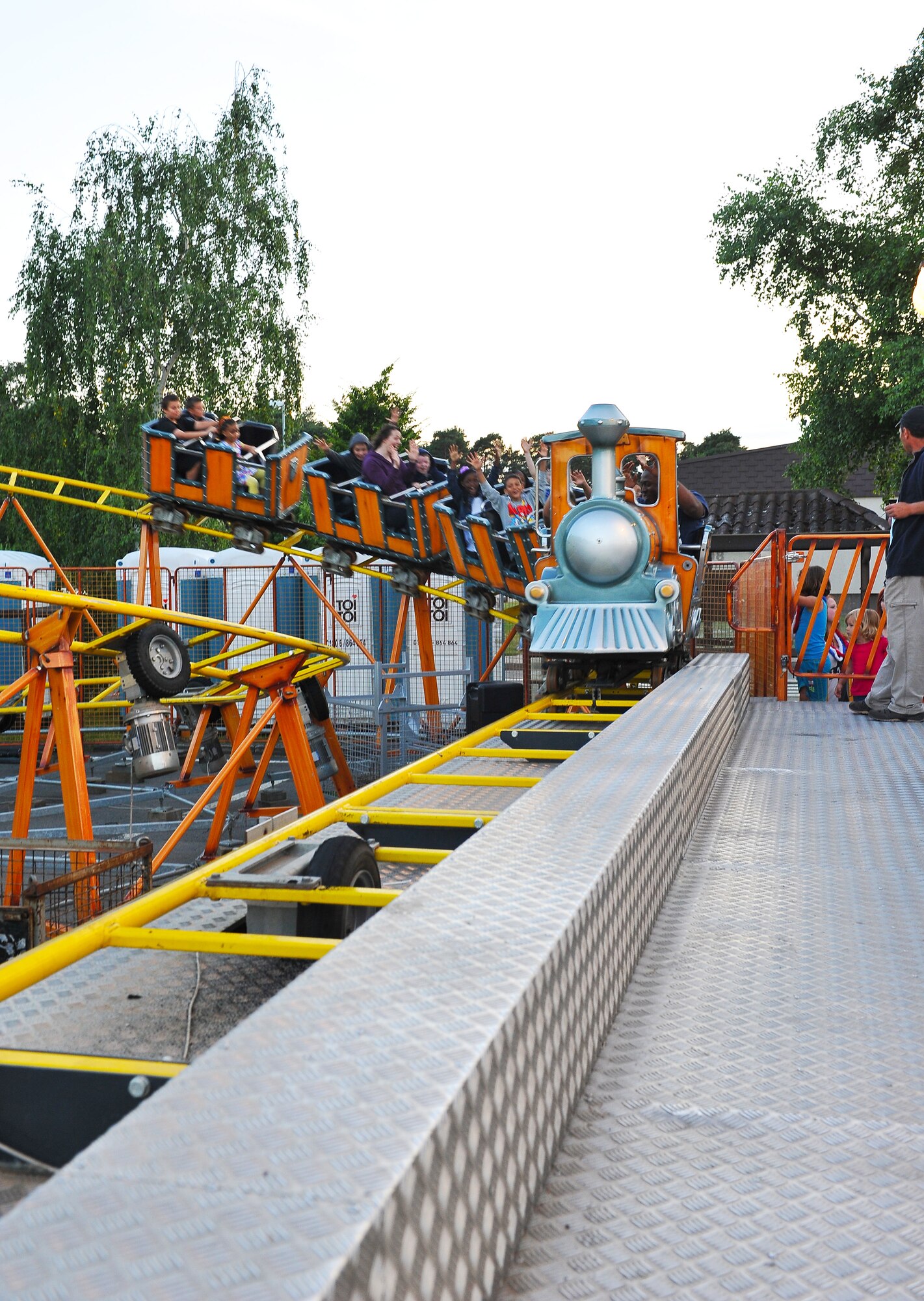 Rockin 4th of July’ attendees enjoy a rollercoaster during the festival held to celebrate the independence of the United States of America, July 4, 2013, Ramstein Air Base, Germany. America declared its independence from Britain on July 4, 1776, now considered the birth day of the United States of America. 237 years later it is still celebrated remember the day of declared independence. Ramstein celebrated with festivities to included; live music, children’s activities, carnival rides, food specialties and a fireworks show. (U.S. Air Force photo/Airman Dymekre Allen)