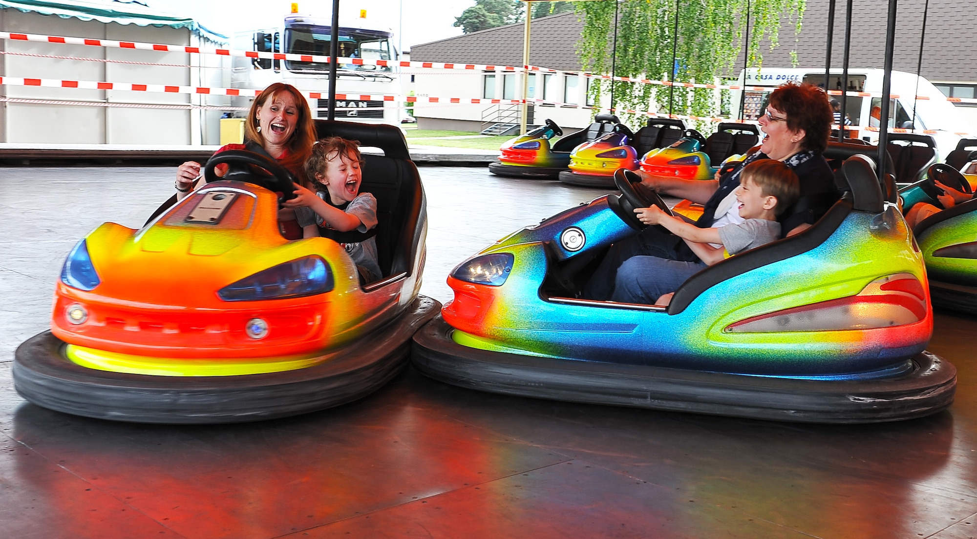 ‘Rockin 4th of July attendees ride bumper cars to celebrate the independence of the United States of America, July 4, 2013, Ramstein Air Base, Germany. America declared its independence from Britain on July 4, 1776, now considered the birth day of the United States of America. 237 years later it is still celebrated remember the day of declared independence. Ramstein celebrated with festivities to included; live music, children’s activities, carnival rides, food specialties and a fireworks show. (U.S. Air Force photo/Airman Dymekre Allen)