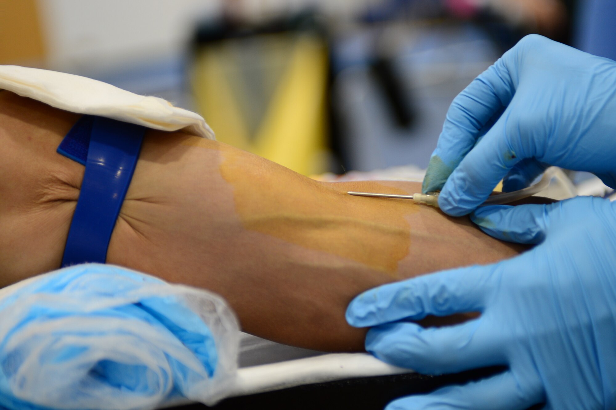 ROYAL AIR FORCE LAKENHEATH, England – Airman 1st Class Manuel Northington, 48th Civil Engineer Squadron water and fuels systems apprentice, donates blood during a blood drive at RAF Lakenheath’s Health and Wellness Center July 10, 2013. Personnel from Landstuhl Regional Medical Center’s Armed Services Blood Program in Germany came to RAF Lakenheath and RAF Mildenhall to conduct blood drives. The ASBP only collects blood from the military community, which includes service members, family members, retirees and Department of Defense civilians, and all blood collected stays in the military community.  (U.S. Air Force photo by Airman 1st Class Dana J. Butler)