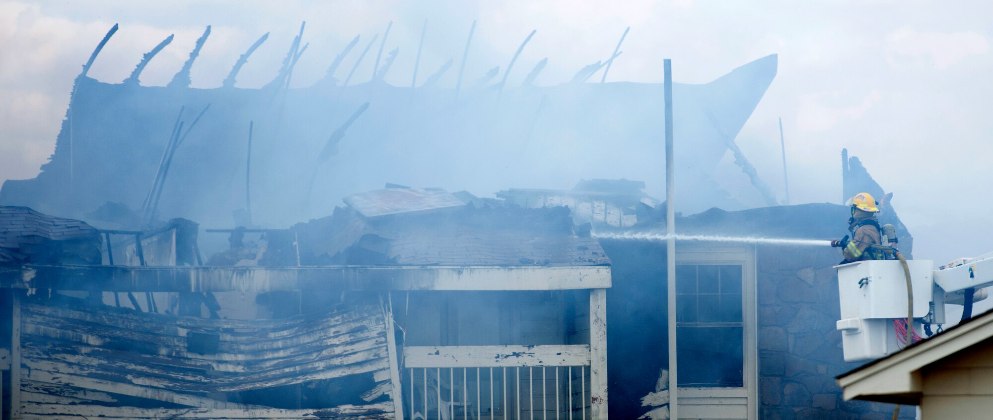 ALTUS, Okla. – Firefighters work to extinguish a fire at Apple Creek Apartments, July 8.  Firefighters from the City of Altus, Altus Air Force Base, Blair and Friendship assisted in putting out the fire that erupted in the living quarters. (U.S. Air Force photo by Senior Airman Jesse Lopez / Released)