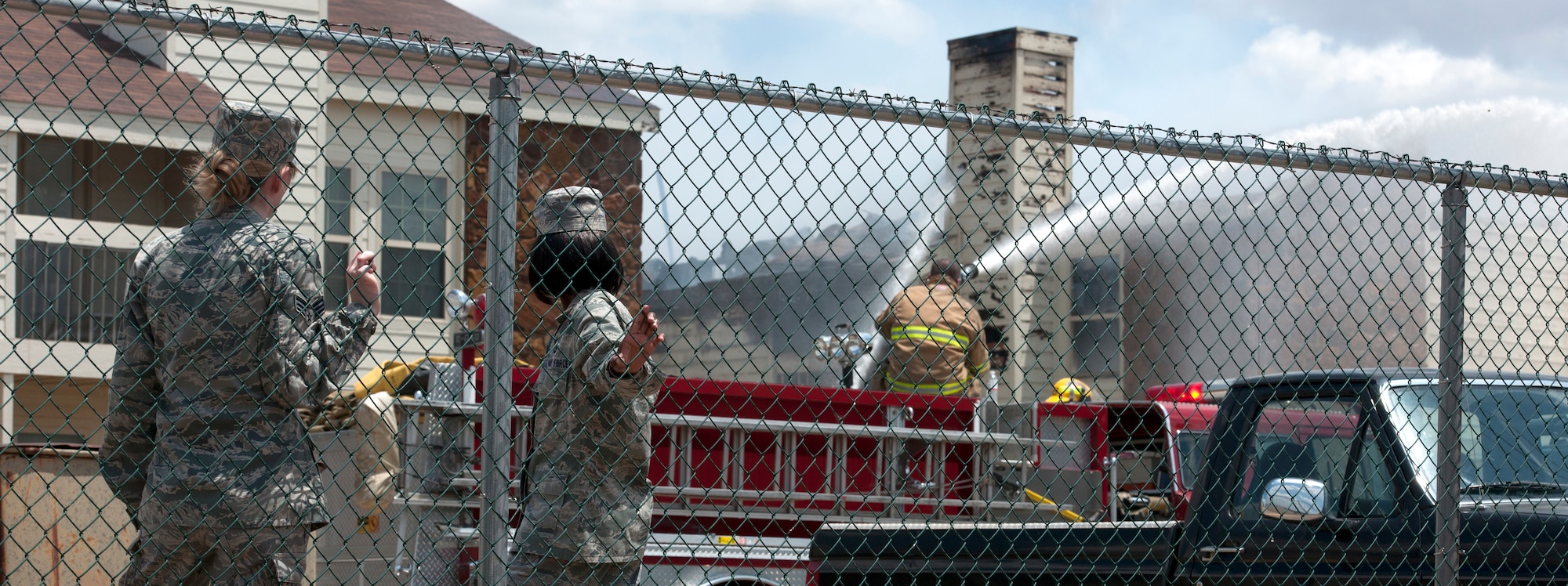 ALTUS, Okla. – Firefighters work to extinguish a fire at Apple Creek Apartments, July 8.  Firefighters from the City of Altus, Altus Air Force Base, Blair and Friendship assisted in putting out the fire that erupted in the living quarters. (U.S. Air Force photo by Senior Airman Jesse Lopez / Released)