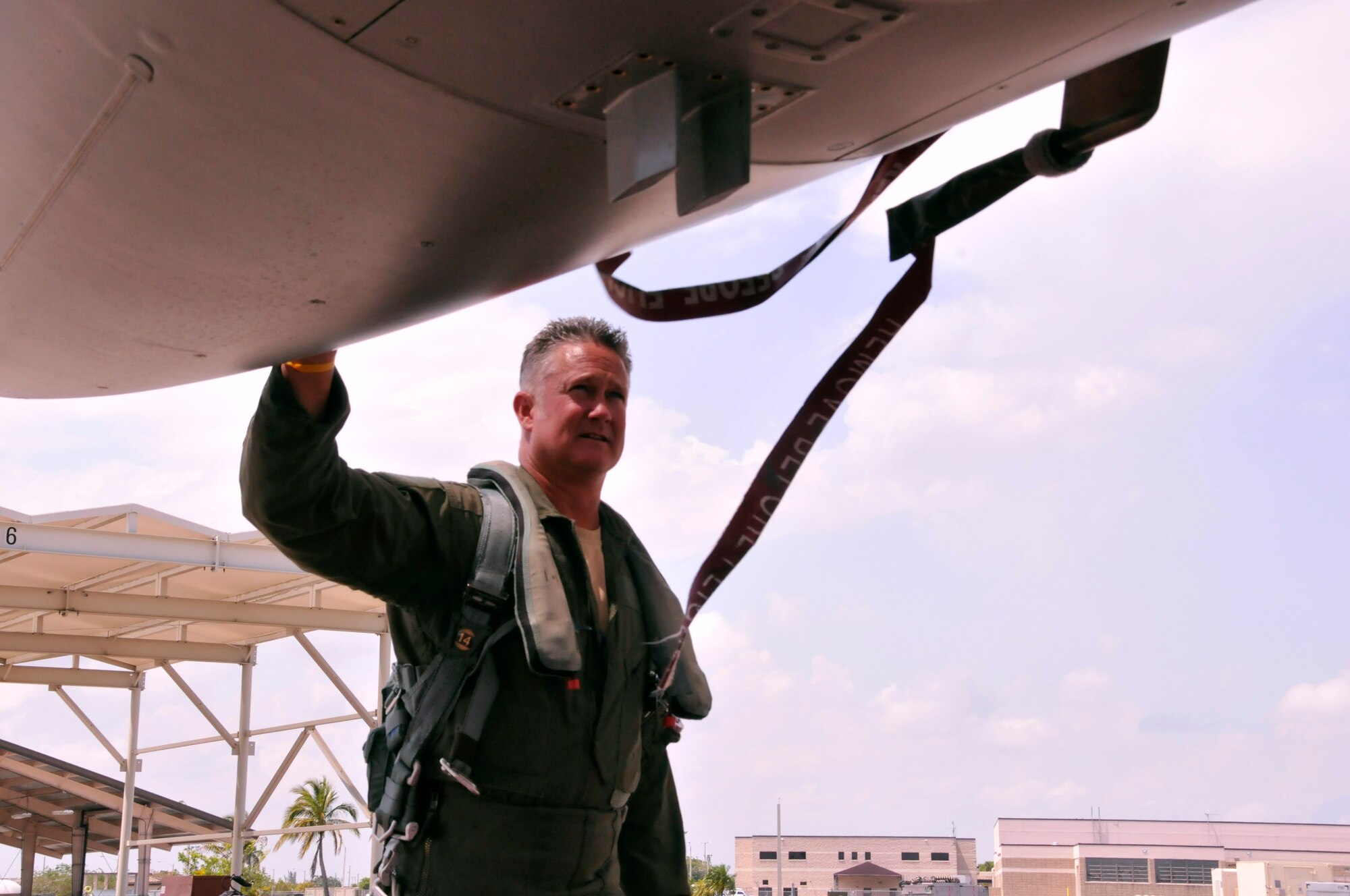 Maj. Robin Lytle, 93rd Fighter Squadron F-16 pilot and chief of scheduling, performs a pre-flight inspection on an F-16 at Homestead Air Reserve Base, Fla., May 9. Lytle began his career as a weapons loader at Bergstrom Air Force Base, Texas, in 1989. (U.S. Air Force photo/Senior Airman Jaimi Upthegrove)