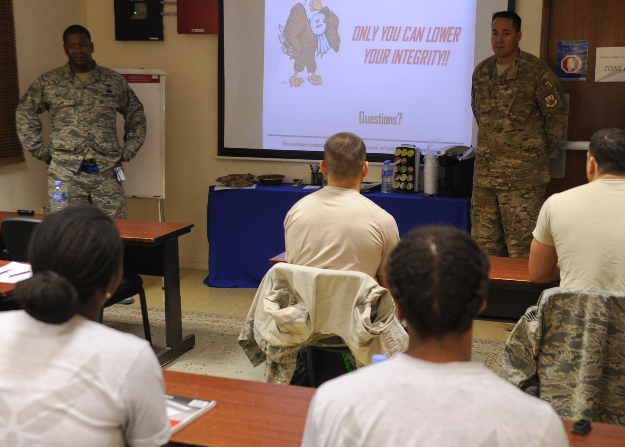 Senior Master Sgt. Jarrell Butler and Master Sgt. Larry Shelvy teach a class on Enlisted Force Structure Ethics and Core Values in the Airman and Family Readiness Center at the 379th Air Expeditionary Wing in Southwest Asia, June 10, 2013. Butler is the 379th Expeditionary Communications Squadron plans and resources flight chief deployed from Davis-Monthan, Ariz., and Shelvy is a U.S. Air Forces Central Command Air Force Forces A6 weather systems support cadre deployed from Camp Blanding, Fla. (U.S. Air Force photo/Senior Airman Bahja J. Jones)