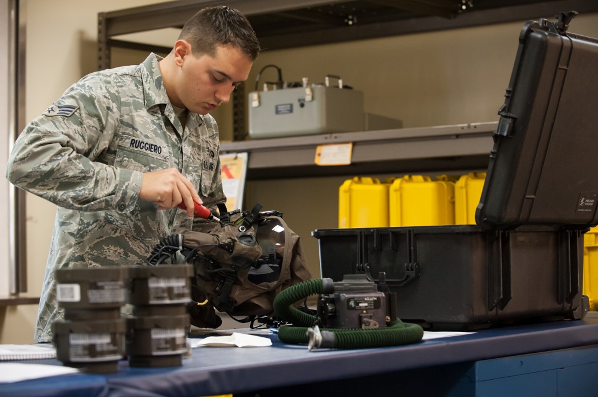 Senior Airman Nicholas Ruggiero, 305th Operations Support Squadron aircrew flight equipment technician, builds an aircrew chemical kit ensemble June 25, 2013, at Joint Base McGuire-Dix-Lakehurst, N.J. All aircrew members will receive the kits which will protect them against chemical environments. Ruggiero hails from Raleigh, N.C. (U.S. Air Force photo by Russ Meseroll/Released)