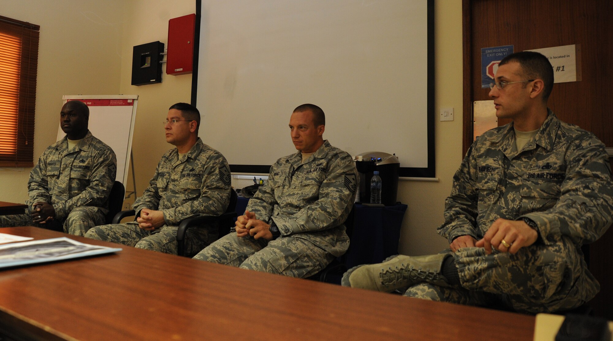 Base first sergeants answer questions on a panel at the Airman and Family Readiness Center at the 379th Air Expeditionary Wing in Southwest Asia, July 9, 2013. The A&FRC hosts mentoring sessions and a number of professional development classes each month. (U.S. Air Force photo/Senior Airman Bahja J. Jones) 