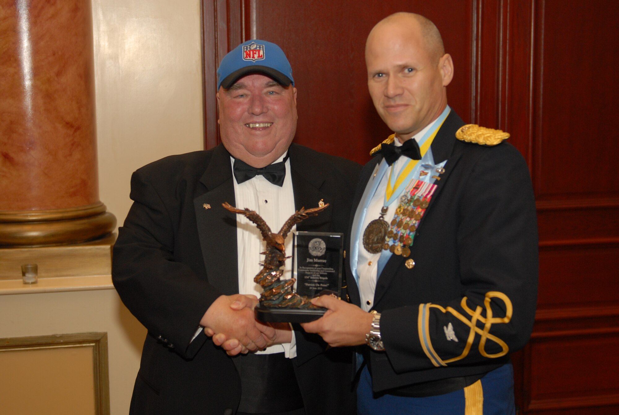 Col. Craig A. Osborne, 174th Infantry Brigade commander, presents the Patriot award to Jimmy Murray, at the 174th Inf. Bde. Army Ball June 28, 2013, at The Merion in Cinnaminson, N.J. Murray is the co-founder of the first Ronald McDonald House and former general manger of the Philadelphia Eagles. (U.S. Army courtesy photo/Released)
