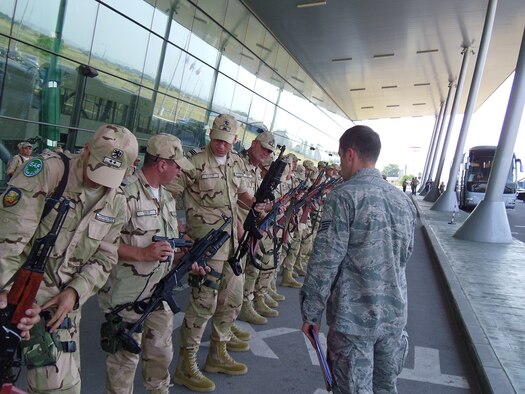 Staff Sgt. Leonid Ridel, 435th Air Mobility Squadron Mobile Aerial Port flight member, ensures weapons are secure before passengers board an aircraft July 7, 2012, in Plovdiv, Bulgaria. The Airmen of the 435th AMS MAPF establish contingency airfield operations at any location throughout the European theater and enable U.S. global reach and power projection. (U.S. Air Force photo / 1st Lt. Kay M. Nissen)