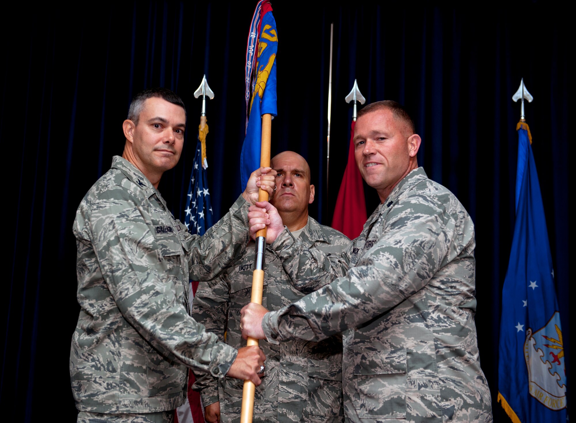 Col. Sean Gallagher, 39th Mission Support Group commander, passes the guidon to Lt. Col. Keith McCormack, 39th Security Forces Squadron incoming commander, during a change of command ceremony July 11, 2013, at Incirlik Air Base, Turkey. The passing of the guidon symbolizes McCormack’s assumption of command from 39th SFS outgoing commander, Lt. Col. Brint Woodruff. (U.S. Air Force photo by Senior Airman Daniel Phelps/Released)
