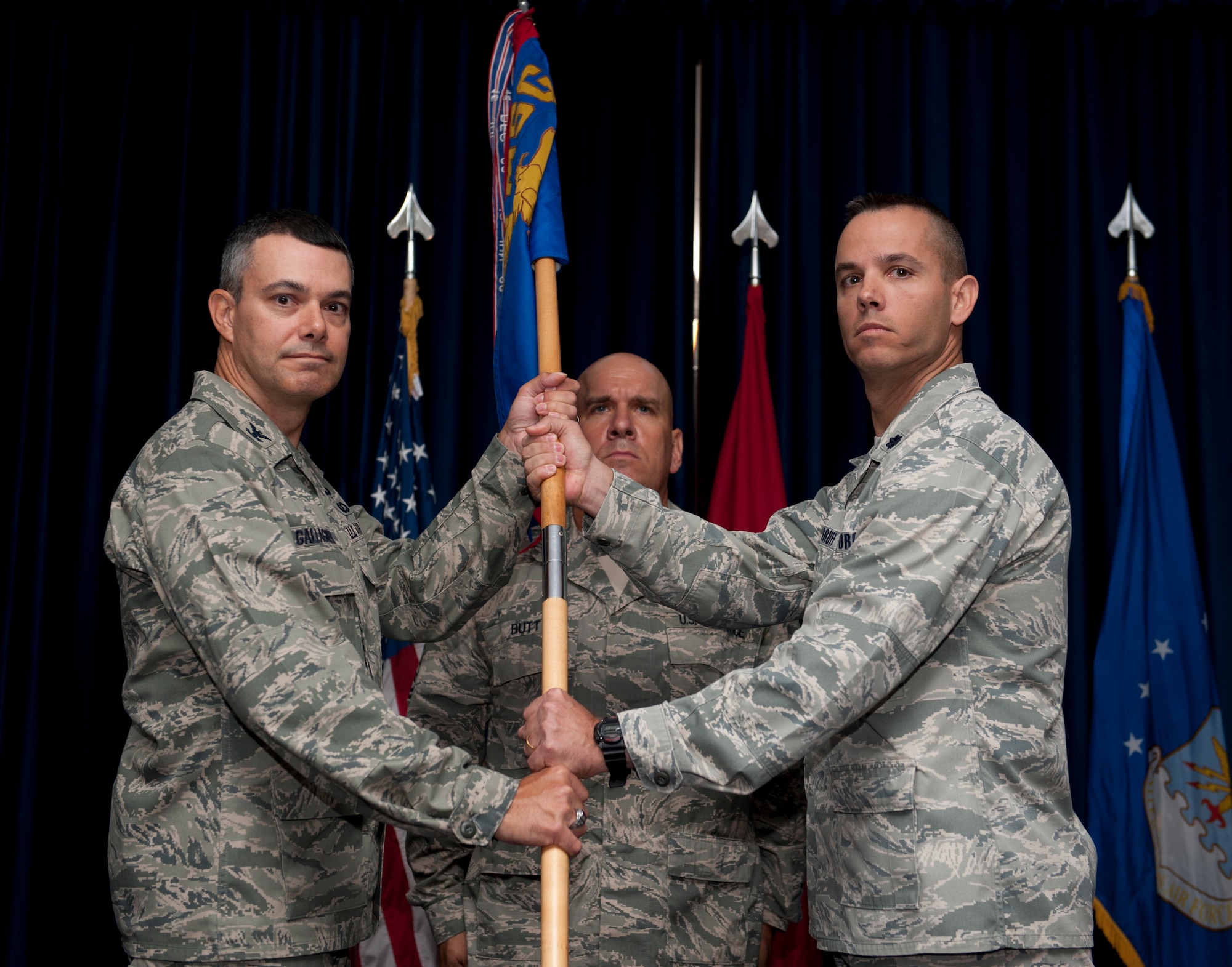 Col. Sean Gallagher, 39th Mission Support Group commander, receives the guidon from Lt. Col. Brint Woodruff, 39th Security Forces Squadron outgoing commander, during a change of command ceremony July 11, 2013, at Incirlik Air Base, Turkey. The ceremony is a tradition in which authority and responsibility for a unit is transferred from one officer to another. (U.S. Air Force photo by Senior Airman Daniel Phelps/Released)

