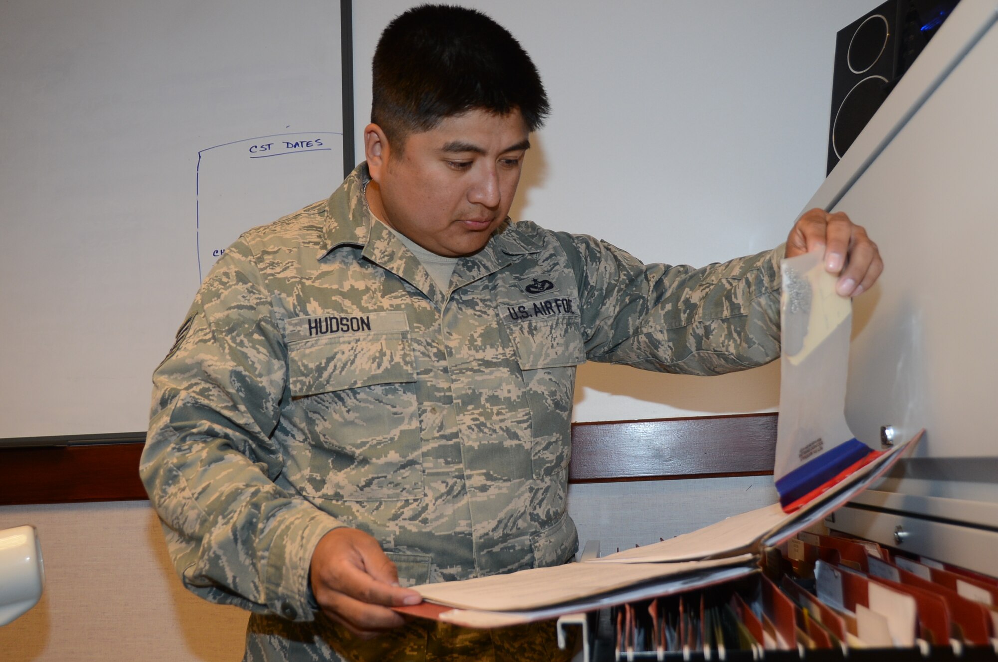 ROYAL AIR FORCE LAKENHEATH, England – Tech. Sgt. Selvin Hudson, 48th Civil Engineer Squadron NCO in charge of Prime Base Engineer Emergency Force training, scans through files July 10, 2013. Hudson was nominated for a Liberty Spotlight because he displays the core value of “Service Before Self.” (U.S. Air Force photo by Airman 1st Class Trevor T. McBride) 