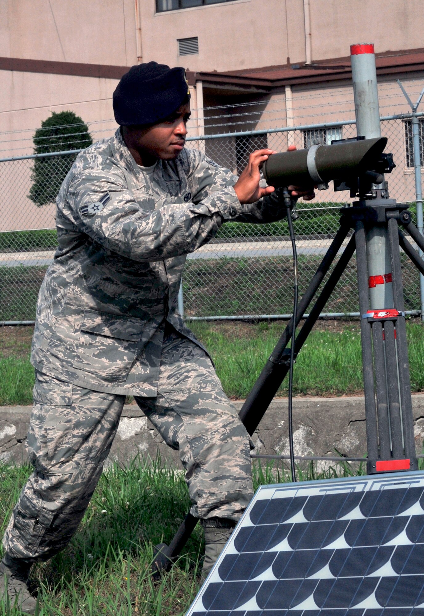 Airman 1st Class Taali Ruffin, 51st Security Forces Squadron tactical automated security system administrator, aligns the transmitter to the receiver of a passive infrared sensor during a regular maintenance inspection on Osan Air Base, Republic of Korea, June 27, 2013. By providing constant surveillance, sensors and alarms, another essential level of protection is provided to Osan’s base defense.  (U.S. Air Force photo/Senior Airman Kristina Overton)