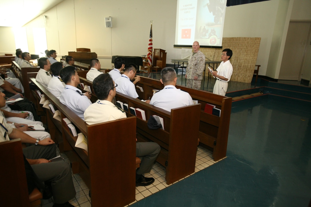 U.S. Marine Col. Preston W. Jones speaks to students and instructors of the Japan Joint Staff College July 3 at Camp Courtney. The discussion gave the students and instructors an overview of the III Marine Expeditionary Force in the Asia-Pacific region and joint operations in the U.S. military. Jones is the future operations officer with G-3, operations, III MEF. (U.S. Marine Corps photo by Lance Cpl. Nicholas S. Ranum/Released)