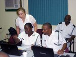 The Bahamas - Stacey Knott, North American Aerospace Defense Command and U.S. Northern Command Public Affairs Social Media specialist, discusses a Social Media application with Royal Bahamas Defence Force Ablewoman Marine Monique Deveaux, RBDF Public Relations specialist, while Leading RBDF Mechanic Roberto Adderley, RBDF Information and Technology office, looks on. Knott was part of a team from NORAD and USNORTHCOM that conducted a two-day Social Media information exchange with the RBDF in The Bahamas July 27-28. 

