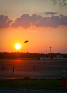 A helicopter lands on Simmons Army Air Field, Aug. 24. FEMA workers arrived at Simmons Army Air Field, Aug. 23, in preparation for Hurricane Irene. The first group of FEMA staff set up the Incident Staging Base in the corner of the air field prepared to welcome over 40 FEMA truck throughout the night and more arriving Aug. 24. FEMA will work hand in hand with the Army Corps of Engineers to ensure Fort Bragg's safety as the hurricane approaches the coastline. 

