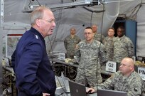 Gen. Craig McKinley, the chief of the National Guard Bureau, visits with National Guard Citizen-Soldiers of Joint Task Force 29 led by the 29th Infantry Division on Jan. 19, 2009, at a temporary operations center established at Fort Belvoir, Va., to coordinate some of the 9,300 National Guard Citizen-Soldiers and -Airmen who are supporting the 56th Presidential Inauguration.