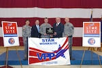 VPP "Star Status" Flag Ceremony. From left: Major General Jessica Wright, Adjutant General of Pennsylvania; Mr. Tad Davis, Deputy Assistant Secretary of the Army for Environment, Safety and Occupational Health; Sergeant Matthew Dohner, Association of Civilian Technicians representative; Mr. Ed Selker, OSHA Deputy Regional Administrator; Colonel Steve Mahoney, facility Commander
