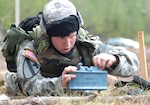 Panama City resident Spc. Loren Brinson of A Troop, 1st Squadron, 153rd Cavalry Regiment, practices placing a claymore anti-personnel mine during his unit's spur ride at Ft. Rucker, Ala., Jan. 10, 2009.