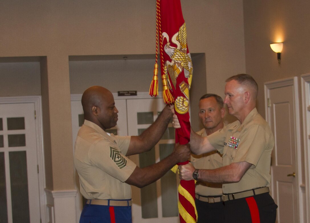 Major Gen. Mark A. Brilakis, commanding general, Marine Corps Recruiting Command returns the colors of MCRC to Sgt. Maj. Michael A. Logan during the MCRC change of command ceremony at the Clubs at Quantico, July 12. Brilakis took command of MCRC from Lt. Gen. Robert E. Milstead, Jr., deputy commandant, Manpower and Reserve Affairs. 