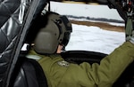 Canadian CH-47 "Chinook" pilot Capt. Sylvie Coutoure, 430th Squadron, Canadian Air Force, performs pre-flight checks at the Army Aviation Support Facility #2 here on Jan. 21 aboard a New York Army National Guard aircraft. Canadian avaitors are preparing for an upcoming deployment to Afghanistan and partnered with the Rochester-based Company B, 3rd Battalion, 126th Aviation for a two-week training period. The 126th Aviation recently returned from a 10-month deployment flying misions in Afghanistan.