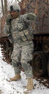 Professional Boxer Sgt. Gilbert Baptist, Troop B, 1st Squadron, 18th Cavalry, throws a punch for the camera at Muscatatuck Urban Training Center.