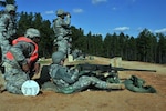 PFC Brian Hults (right) of Alpha Battery, 113th Field Artillery Battalion, 30th Brigade Combat Team, fires a M2 .50 caliber machine gun during training at Camp Shelby, MS. The soldiers will be deploying with the 30th Brigade Deployment Team, North Carolina Army National Guard to Iraq soon.