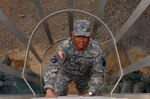 Army Brig. Gen. Rafael O'Ferrall, Joint Task Force Guantanamo deputy commander, climbs down the ladder of a guard tower after visiting with a Trooper at Camp Delta, Jan. 20, 2009.