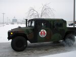 Vehicles from the 205th Military Police Battalion and the 1137th Military Police Company of the Missouri National Guard head out to help communities recover from devastating winter storms.