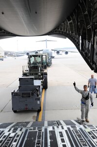 Joint Base McGuire-Dix-Lakehurst airmen load and secure equipment onto aircraft in preparation of Hurricane Irene Aug. 26, 2011. All JB MDL aircraft are being evacuated to Air Force Base's around the country. (U.S. Air Force photo by Airman 1st Class Dennis Sloan)