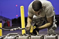 Virginia National Guard Soldiers from the West Point-based 237th Engineer Company prepare for possible duty in response to Hurricane Irene in Onancock August 26 by staging vehicles, equipment and fuel. The Virginia National Guard has been authorized to bring up to 300 personnel on state active duty for possible missions including high water transport and light debris removal. (Photo by Staff Sgt. Andrew H. Owen, Virginia Guard Public Affairs)