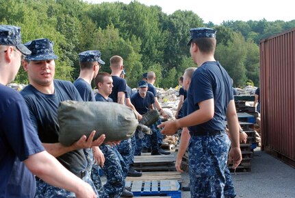 Sailors assigned to Naval Submarine Base New London place sandbags along the waterfront in preparation for possible effects from Hurricane Irene. (U.S. Navy photo by Petty Officer 1st Class Peter D. Blair)
