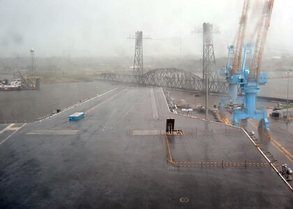 Rain from Hurricane Irene is blown across the bow of the aircraft carrier USS Enterprise (CVN 65) during the height of the storm. Enterprise is moored at the shipyard for safety as Irene passes over the area. (U.S. Navy photo by Petty Officer 2nd Class Michael L. Croft)

