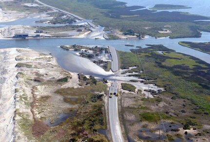 Col. Barrett Holmes, along with Michael Byrne, Glen Sachtleben and Capt. Chris Colbert, get a “bird’s-eye” view of a washed out Highway 12 along the North Carolina coastline Aug. 28 as they soar above in a UH-60 helicopter to conduct an initial damage assessment of North Carolina. Holmes is the defense coordinating officer for U.S. Army North’s Region IV Defense Coordinating Element. Byrne is a federal coordinating officer, and Sachtleben, an operations officer, both with the Federal Emergency Management Agency. Colbert is the pilot of the helicopter from the 3rd Infantry Division’s Combat Aviation Brigade that conducted the flight mission in support of FEMA, which is the overall lead for the federal response effort for Hurricane Irene. 

