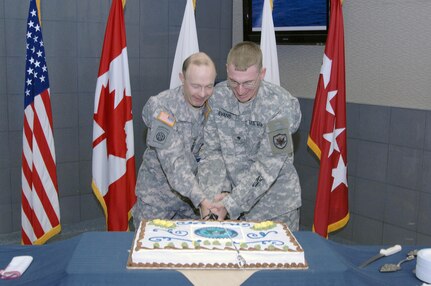Army Gen. Charles H. Jacoby, Jr., North American Aerospace Defense Command and U.S. Northern Command commander, cuts the USNORTHCOM birthday cake with Army Specialist Thomas Evans, NORAD and USNORTHCOM J6, during the command's birthday celebration Sept. 30. USNORTHCOM was established Oct. 1, 2002, in response to the Sept. 11, 2001, terrorist attacks to provide command and control of Department of Defense homeland defense efforts and to coordinate defense support of civil authorities. 

