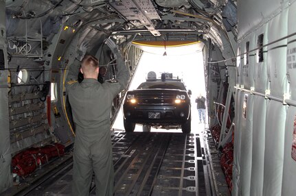 Airman 1st Class Richie Meyer, 39th Airlift Squadron loadmaster, guides the NORAD and USNORTHCOM Emergency Response Vehicle into the back of a C-130J aircraft in preparation for a flight to a disaster response exercise in Montana May 5. The customized 2010 Chevrolet Suburban sports an advanced communications package that provides U.S. Northern Command with phone communications, secured computer networks, commercial internet and video teleconferencing in a mobile package small enough to be transported by a C-130. This is the first time the ERV is being airlifted to a site in support of an exercise. 

