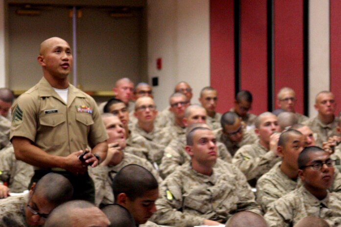 Sergeant Gersom Canales, an academic instructor, Instructional Training Company, Support Battalion, reads a slide to recruits during a history class aboard Marine Corps Recruit Depot San Diego June 28.  Academic instructors are trained drill instructors selected to teach recruits various Marine Corps subjects. 