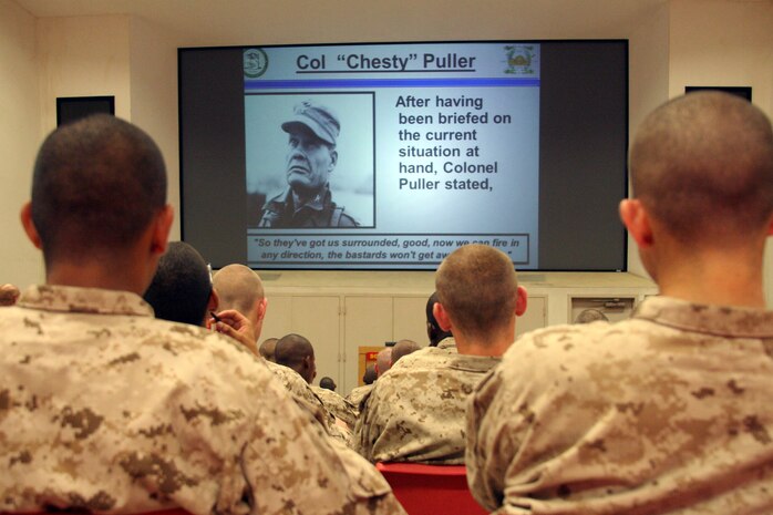 Recruits from Company H, 2nd Recruit Training Battalion, read about Col. Chesty Puller during a history class aboard Marine Corps Recruit Depot San Diego June 28.  For many recruits, this was the first time they learned about Marine Corps history.